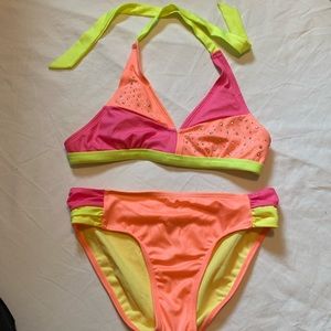 New without tags. Justice Size 16 2 piece bikini.  Orange, pink and yellow